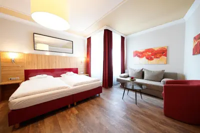 Ein Bett oder Betten in einem Zimmer der Unterkunft Hotel Bayerischer Hof