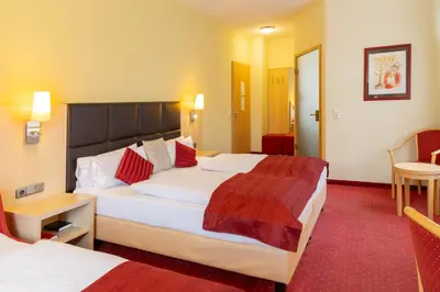 Ein Bett oder Betten in einem Zimmer der Unterkunft Hotel An der Eiche