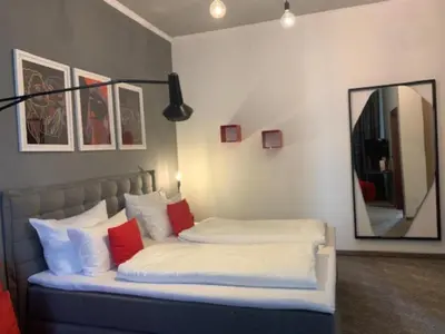 Ein Bett oder Betten in einem Zimmer der Unterkunft Hotel Maxplatz