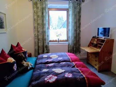 Ein Bett oder Betten in einem Zimmer der Unterkunft Ferienwohnung Rogowski