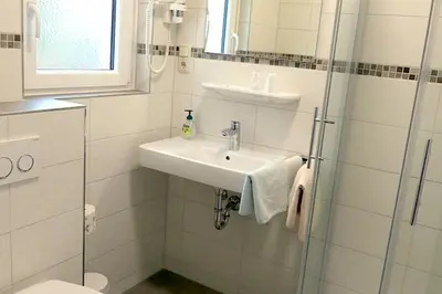 Ein Badezimmer in der Unterkunft Hotel Munzert