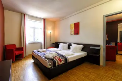 Ein Bett oder Betten in einem Zimmer der Unterkunft Santé Royale Hotel- & Gesundheitsresort Bad Brambach