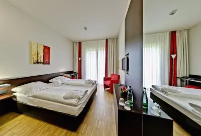 Ein Bett oder Betten in einem Zimmer der Unterkunft Santé Royale Hotel- & Gesundheitsresort Bad Brambach
