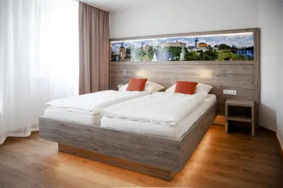Ein Bett oder Betten in einem Zimmer der Unterkunft Hotel Ertl