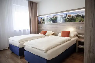 Ein Bett oder Betten in einem Zimmer der Unterkunft Hotel Ertl