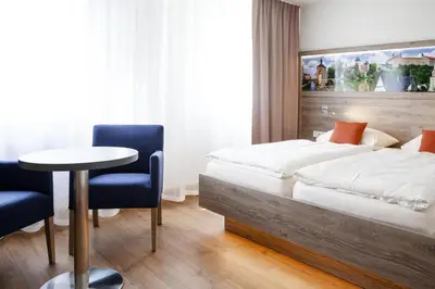 Ein Bett oder Betten in einem Zimmer der Unterkunft Hotel Ertl