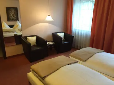Ein Bett oder Betten in einem Zimmer der Unterkunft Hotel Goldener Hirsch
