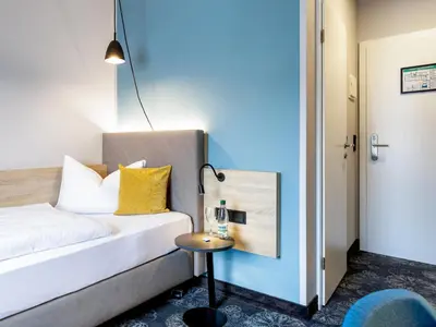 Ein Bett oder Betten in einem Zimmer der Unterkunft Hotel Purucker