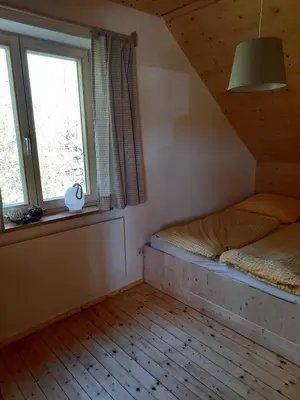 Ein Bett oder Betten in einem Zimmer der Unterkunft Jagdhaus im Grünen, mit Sauna