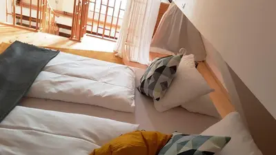 Ein Bett oder Betten in einem Zimmer der Unterkunft Apartment Pegnitzmühle mit Pegnitzinsel