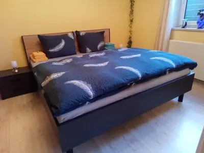 Ein Bett oder Betten in einem Zimmer der Unterkunft Ferienwohnung Dinnebier