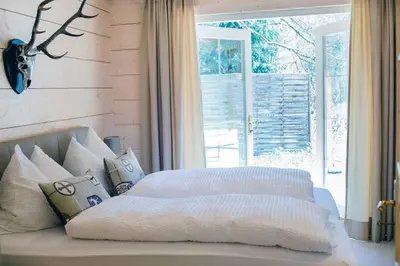 Ein Bett oder Betten in einem Zimmer der Unterkunft Chalet Bischofsmühle
