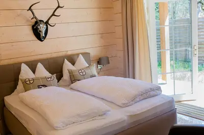 Ein Bett oder Betten in einem Zimmer der Unterkunft Chalet Bischofsmühle