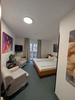 Ein Bett oder Betten in einem Zimmer der Unterkunft Parkhotel Bad Brambach