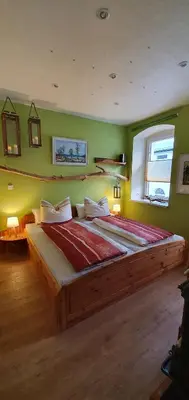 Ein Bett oder Betten in einem Zimmer der Unterkunft Enderlein´s Ferienwohnung