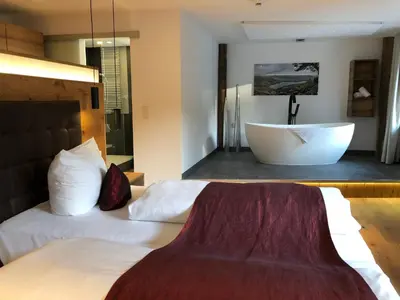 Ein Bett oder Betten in einem Zimmer der Unterkunft Hotel Kainsbacher Mühle