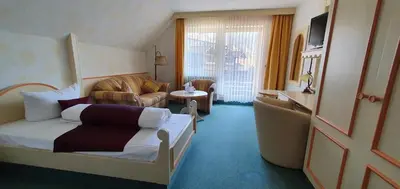 Ein Bett oder Betten in einem Zimmer der Unterkunft Hotel Kainsbacher Mühle