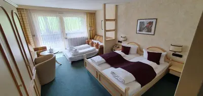 Ein Bett oder Betten in einem Zimmer der Unterkunft Hotel Kainsbacher Mühle