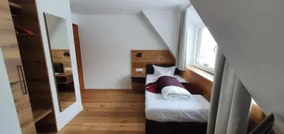 Ein Bett oder Betten in einem Zimmer der Unterkunft Hotel Kainsbacher Mühle