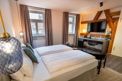 Ein Bett oder Betten in einem Zimmer der Unterkunft Hotel Weißes Ross