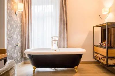Ein Badezimmer in der Unterkunft Hotel Hartl's Lindenmühle