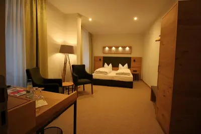 Ein Bett oder Betten in einem Zimmer der Unterkunft Hotel Hartl's Lindenmühle