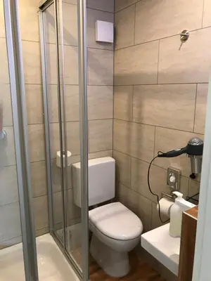 Ein Badezimmer in der Unterkunft Hotel Hartl's Lindenmühle