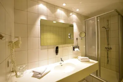 Ein Badezimmer in der Unterkunft Hotel Alexandra
