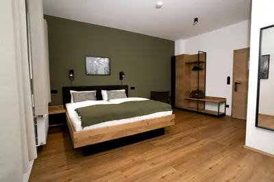 Ein Bett oder Betten in einem Zimmer der Unterkunft Holzfellas Home
