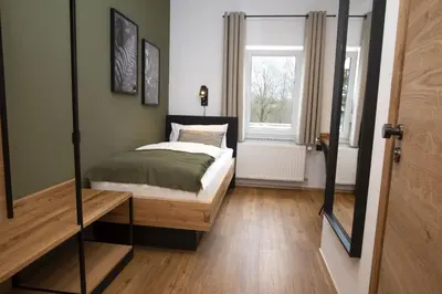 Ein Bett oder Betten in einem Zimmer der Unterkunft Holzfellas Home