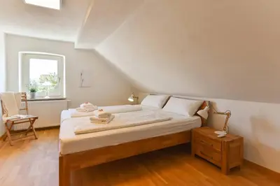 Ein Bett oder Betten in einem Zimmer der Unterkunft Dachgiebeloase