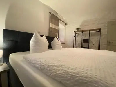 Ein Bett oder Betten in einem Zimmer der Unterkunft Mühlenhof Mähring