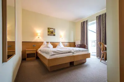 Ein Bett oder Betten in einem Zimmer der Unterkunft Hotel Gasthof Fenzl