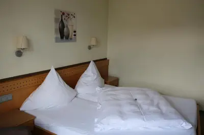 Ein Bett oder Betten in einem Zimmer der Unterkunft Hotel Gasthof Fenzl