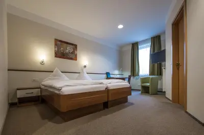 Ein Bett oder Betten in einem Zimmer der Unterkunft Hotel Gasthof Fenzl