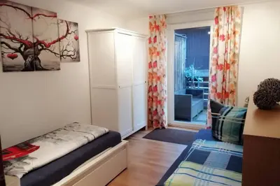 Ein Bett oder Betten in einem Zimmer der Unterkunft Direkt im Herzen von Bayreuth Wohnung S9 mit 115qm und großem Balkon
