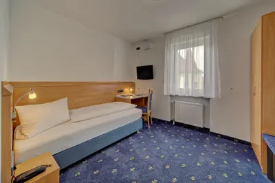 Ein Bett oder Betten in einem Zimmer der Unterkunft Hotel Post
