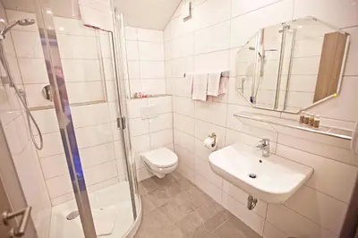 Ein Badezimmer in der Unterkunft Hotel Post