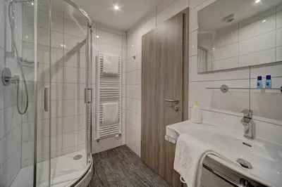 Ein Badezimmer in der Unterkunft Hotel Post
