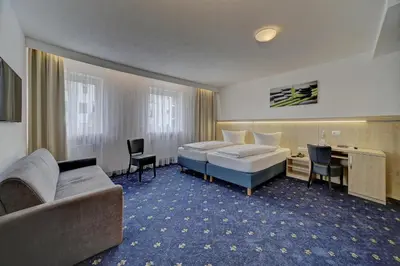 Ein Bett oder Betten in einem Zimmer der Unterkunft Hotel Post