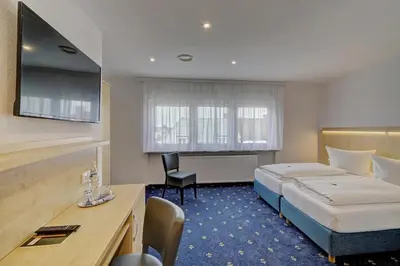 Ein Bett oder Betten in einem Zimmer der Unterkunft Hotel Post