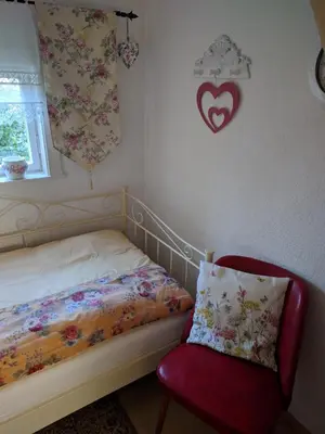 Ein Bett oder Betten in einem Zimmer der Unterkunft Ferienhaus Johanna & Ferienwohnung Thum