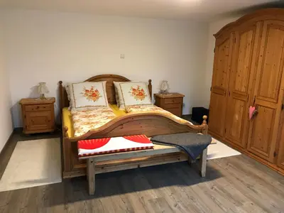 Ein Bett oder Betten in einem Zimmer der Unterkunft Ferienwohnung „Frosch“