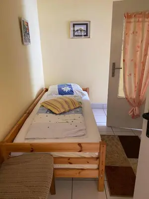 Ein Bett oder Betten in einem Zimmer der Unterkunft Ferienwohnung Goldener Drache