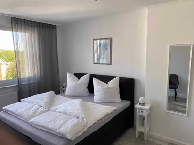 Ein Bett oder Betten in einem Zimmer der Unterkunft Ferienwohnung Nußmann