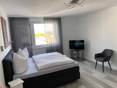 Ein Bett oder Betten in einem Zimmer der Unterkunft Ferienwohnung Nußmann