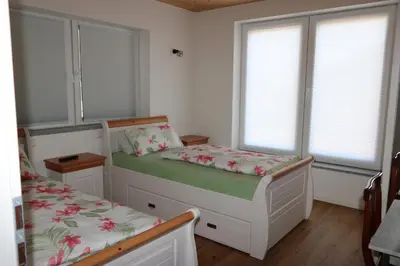 Ein Bett oder Betten in einem Zimmer der Unterkunft Ferienwohnung Bittner