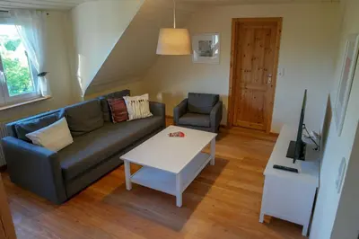 Ein Sitzbereich in der Unterkunft Ferienwohnung Wölfel