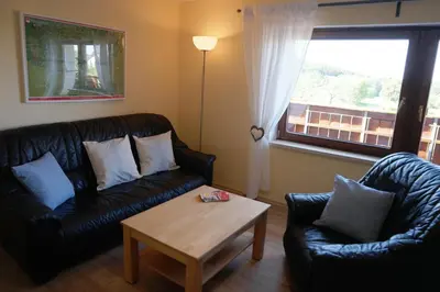 Ein Sitzbereich in der Unterkunft Ferienwohnung Wölfel