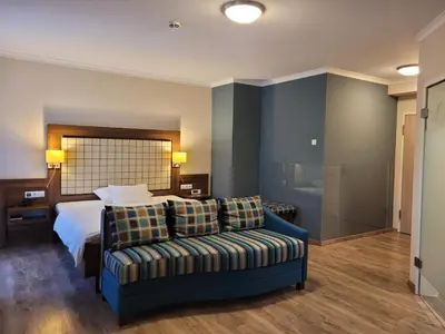 Ein Bett oder Betten in einem Zimmer der Unterkunft Hotel Number One